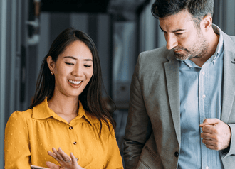 An Exos coach welcoming an employee at launch