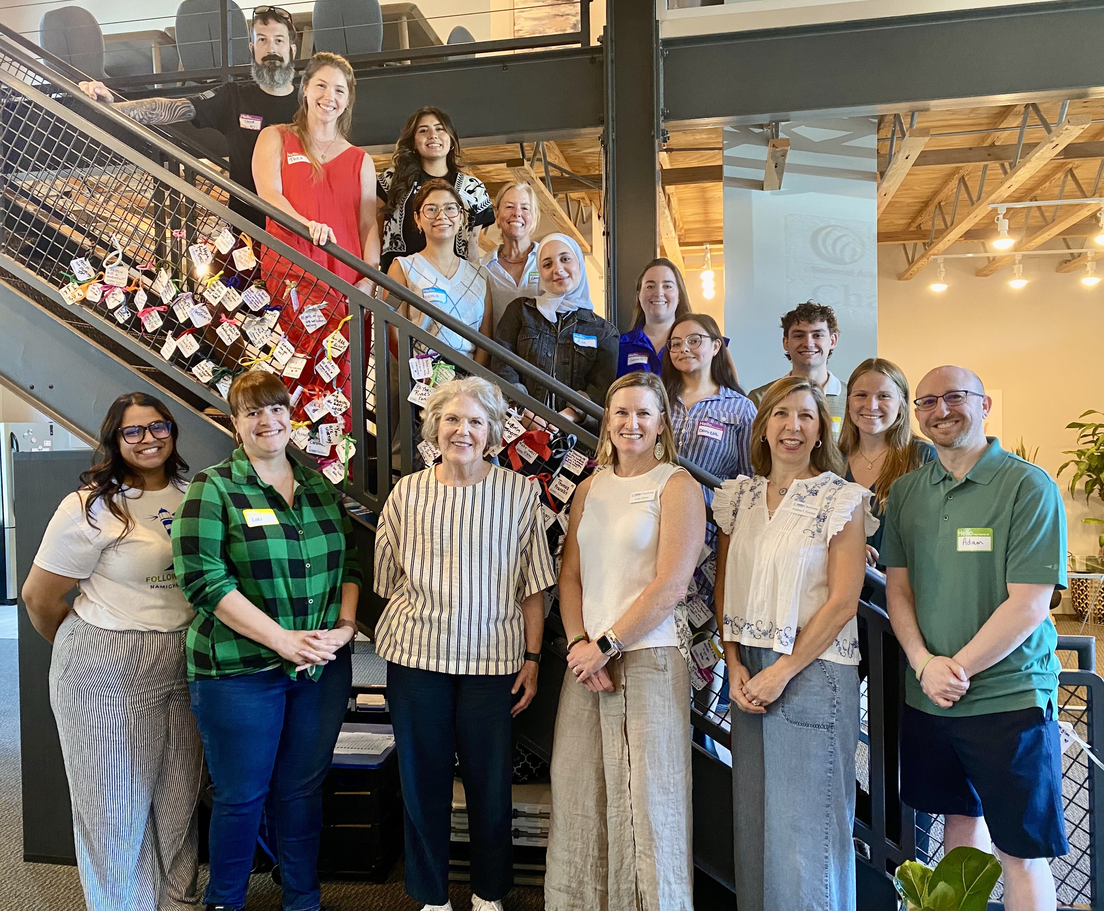 Members of the NAMI Navigator Charlotte Summer 2026 cohort gathered together on a staircase.
