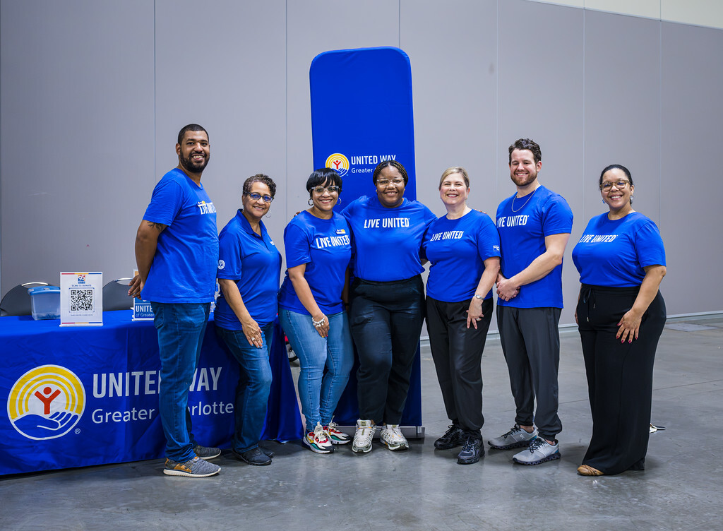 United Way of Greater Charlotte team members standing together at a community event.