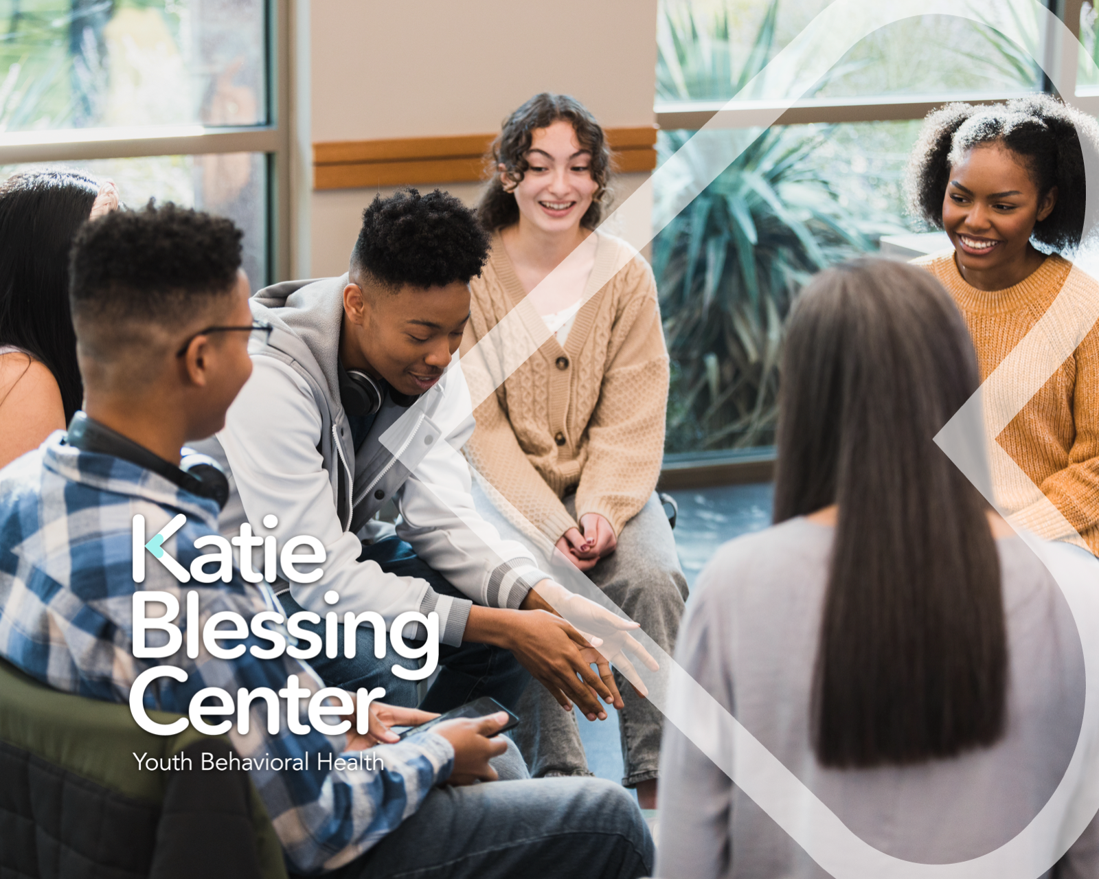 Young people participating in a group discussion at Katie Blessing Center.