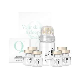 Skincare product set with bottles and a micro infusion applicator.