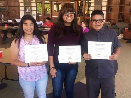 Students with award certificates