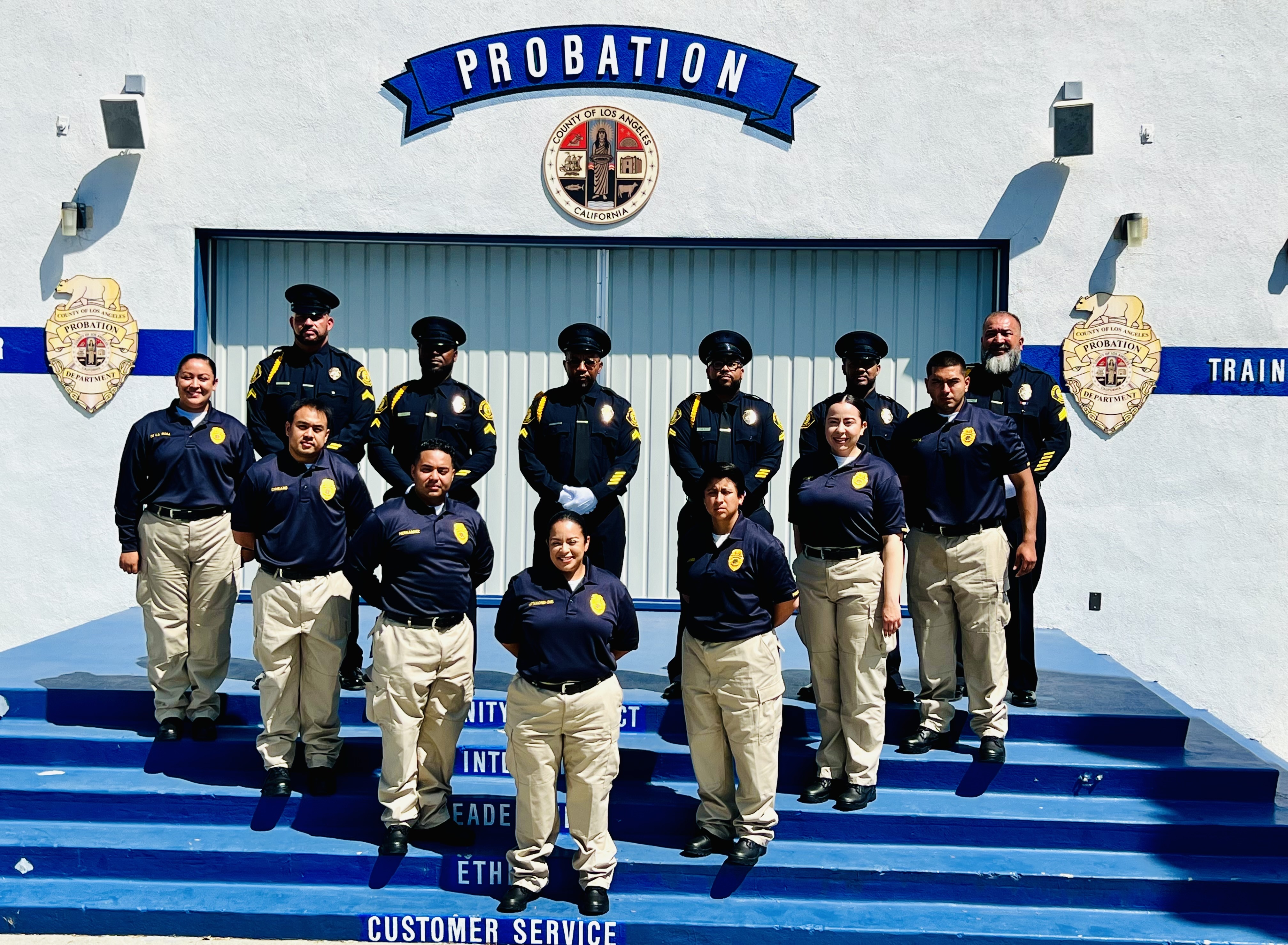 A class of LACP officers posing at academy ceremony