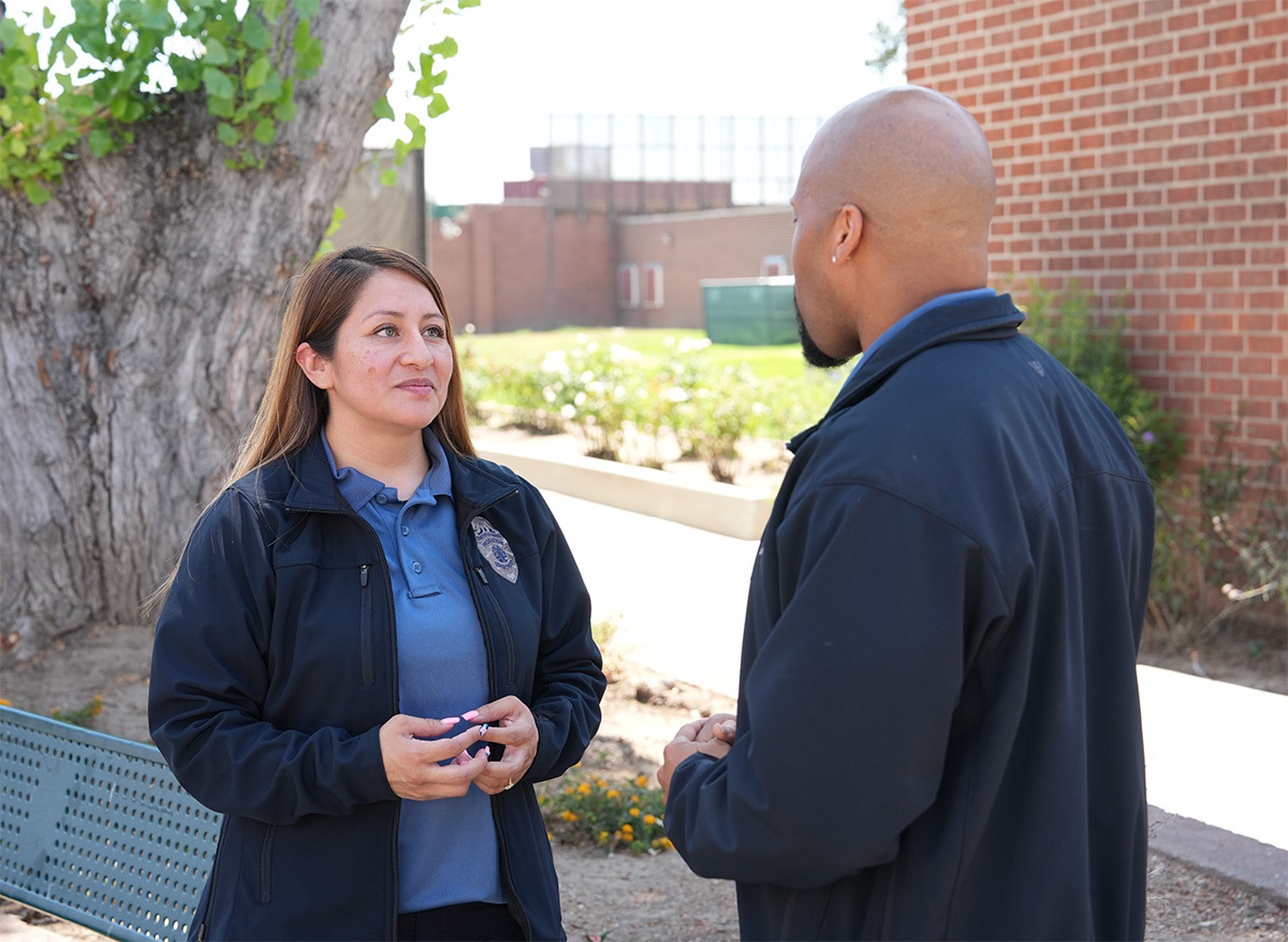 A female and a male Deputy Probation Officer talking