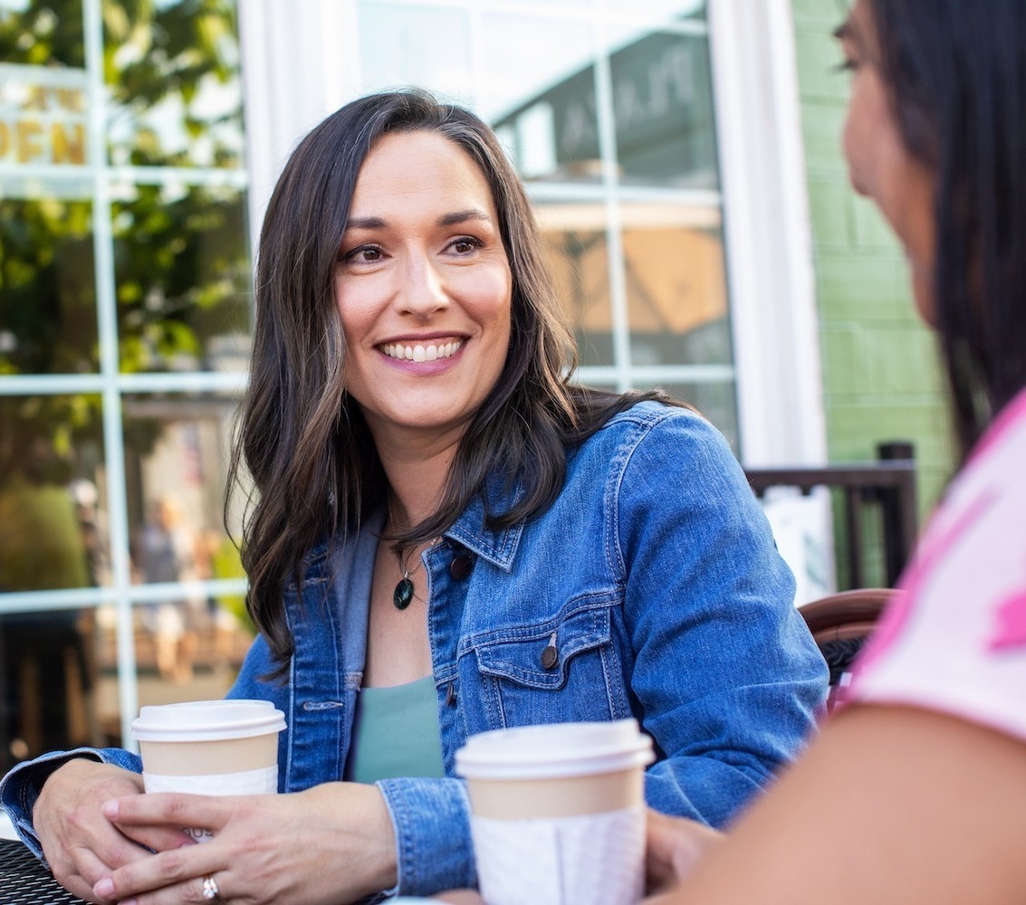 Joy talks with a Mason resident over coffee
