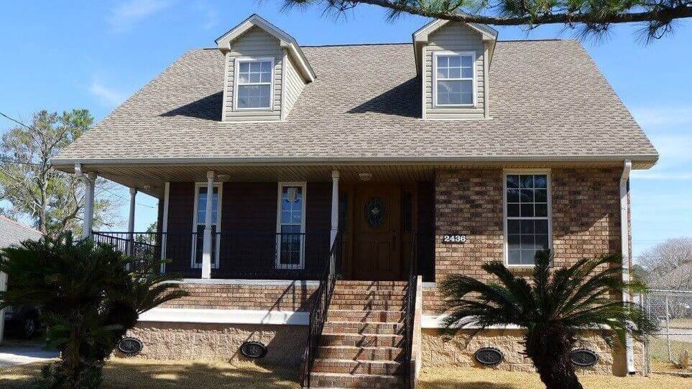 The same home raised above flood level with new stairs and skirting