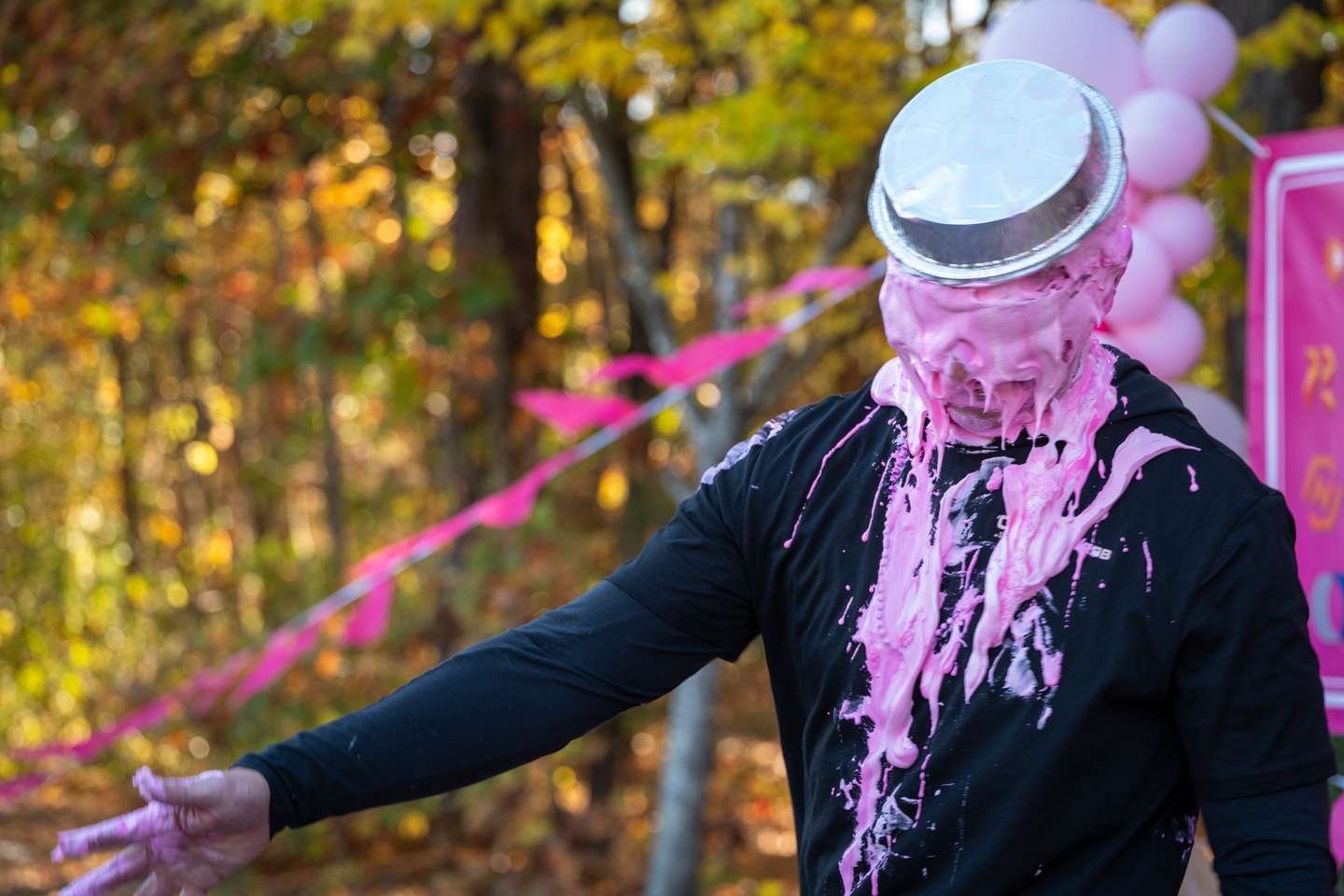 A Pies for a Cure participant covered in pink pie