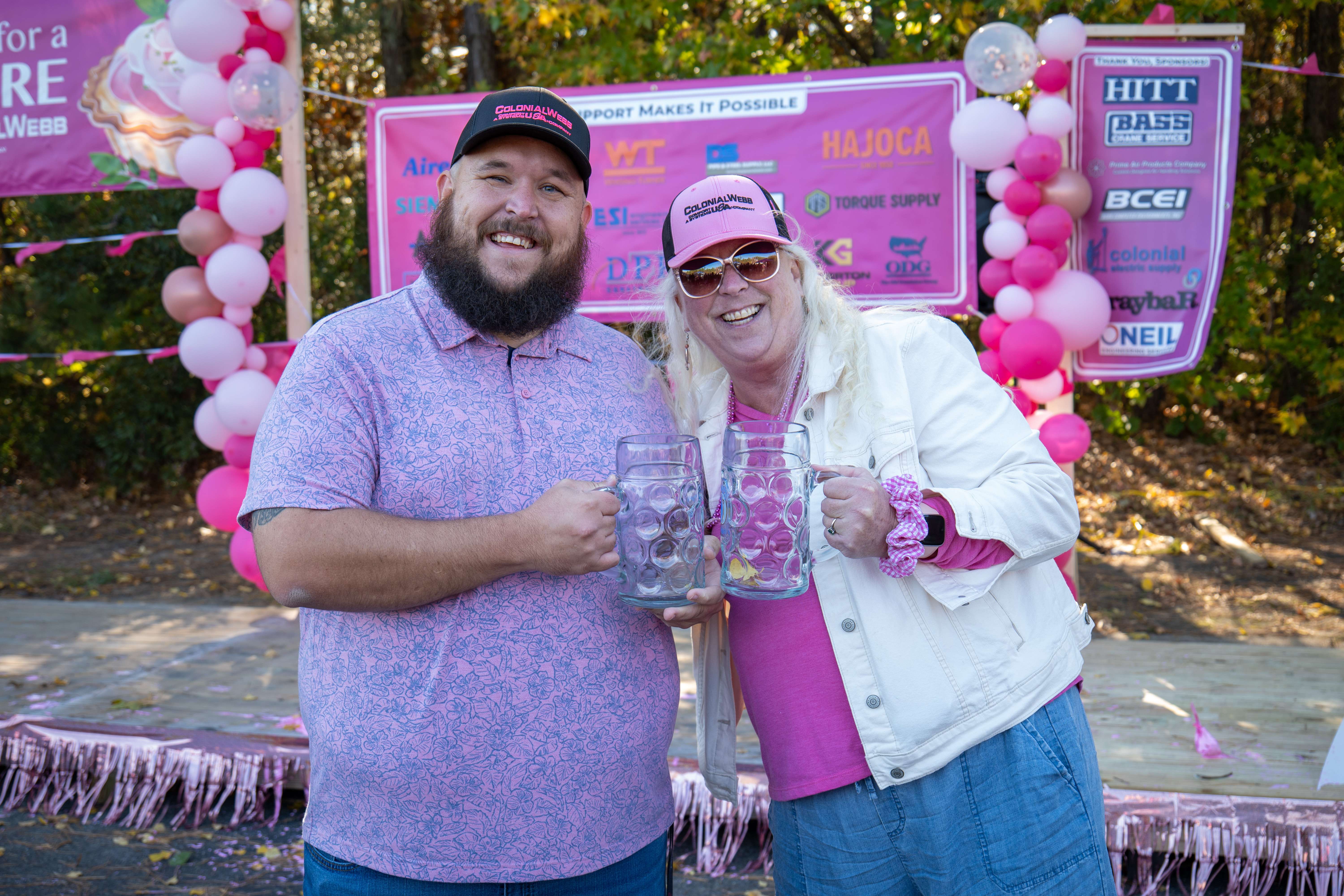 Two Pies for a Cure supporters smiling together at the event