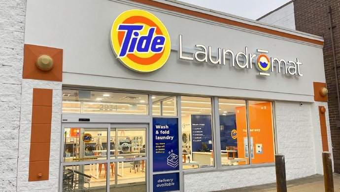 Tide Laundromat interior with smart washers that auto-dose the perfect amount of water, detergent, and softener for every load