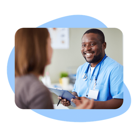 Male medical assistant talking to patient